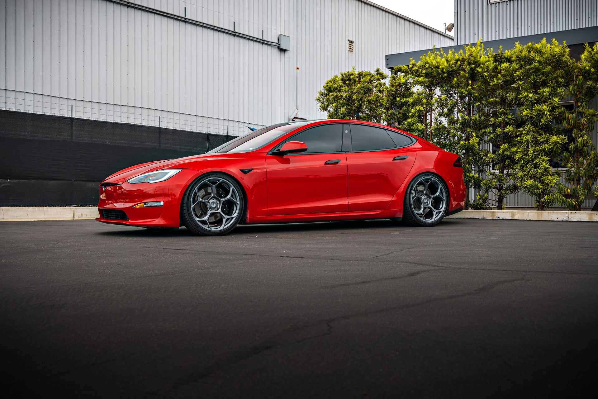 Red Tesla Model S Plaid with Air Suspension Lowering Kit on UP Forged UP-05 Wheels in Satin Titanium