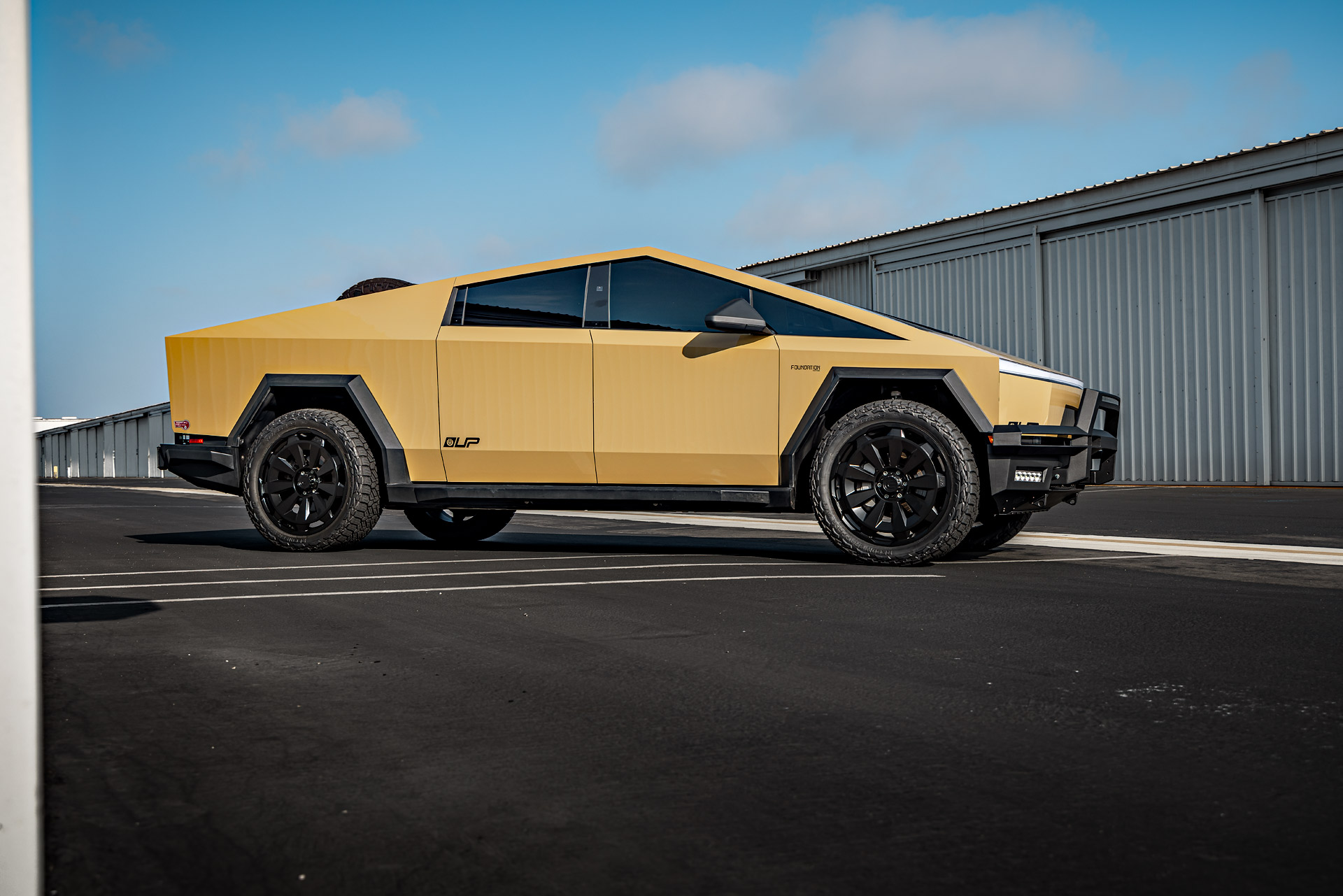Tan Wrapped Tesla Cybertruck with 24-Inch UP Forged CYBRNOVA in Satin Black